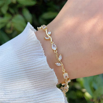 Gold Tone Tulip Crystal Bracelet with Floral Vine Design